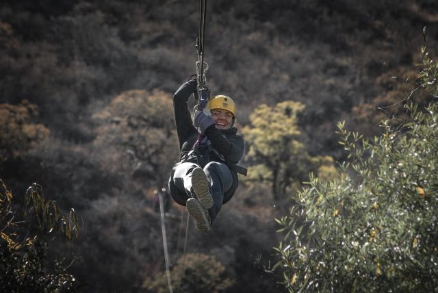 Woman on a wire rope zip wire